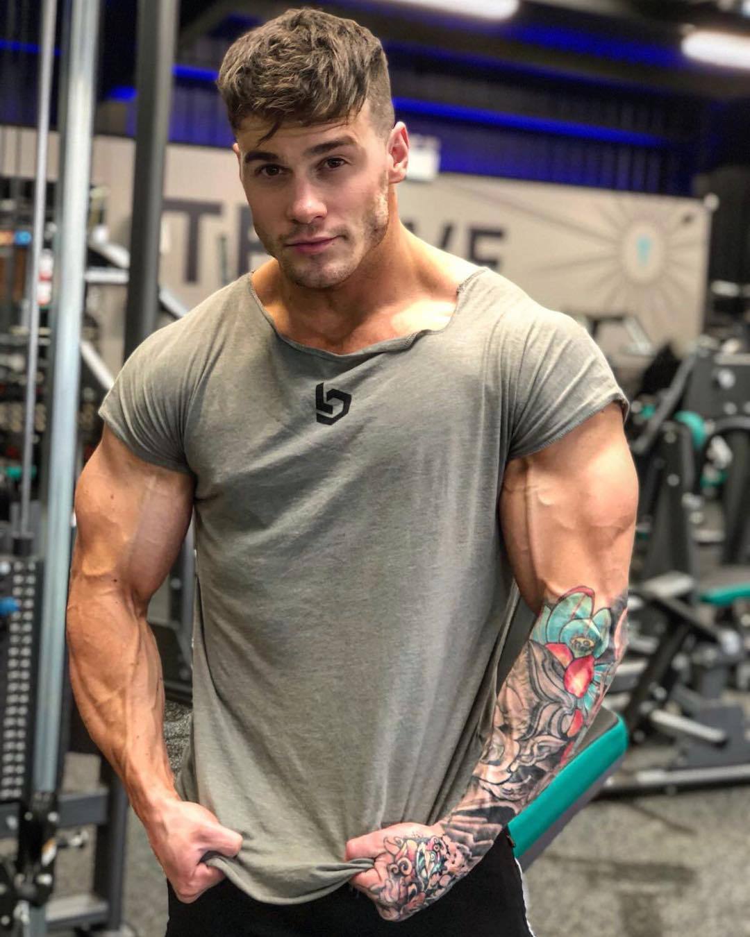 Muscle Fitness Brothers Fitness Clothes Men's Short Sleeve T-shirt Large Size Irregular Collar Sportswear Manufacturers